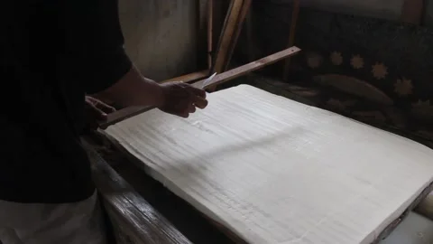 Processing of making tofu. an Indonesian man makes tofu the traditional way. Stock Footage 214234197