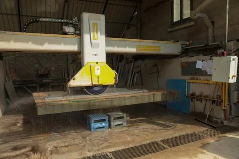 Processing of marble in the quarry. Stock Photos