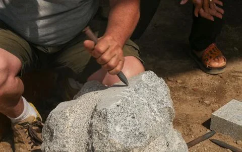 Processing of marble in the quarry. Stock Photos