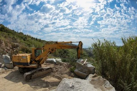 Processing of marble in the quarry. Stock Photos