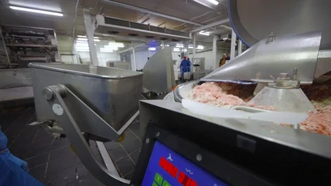 Processing of meat in the food industry on a cutter Stock Footage 99552514