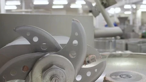 Processing of meat in the food industry on a cutter Stock Footage 104402180