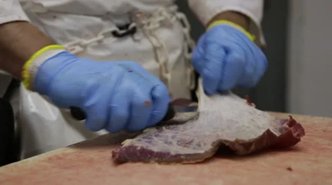 Processing meat production trimming fat off beef Stock Footage 40667821