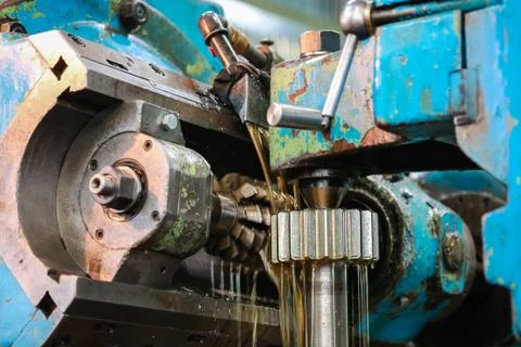 Processing of metal detail on the old machine. Stock Photos