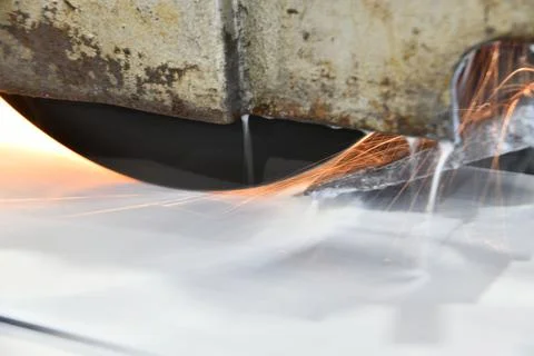 Processing of metal by grinding on a flat grinding machine Stock Photos