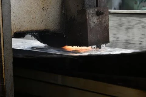 Processing of metal by grinding on a flat grinding machine 写真素材