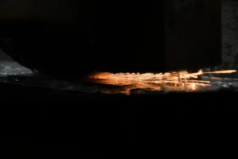 Processing of metal by grinding on a flat grinding machine Stock Photos