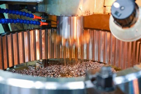 Processing of metal parts on the machine. Heavy industry. Stock Photos