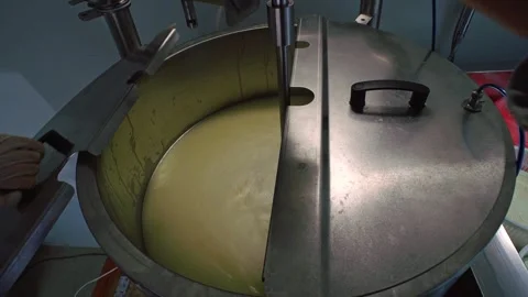 Processing milk into cheese in cheese making. automatic system for the productio Stock Footage 227542373
