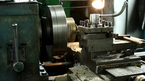 Processing of parts on an old lathe in a factory workshop Stock Footage 115086358