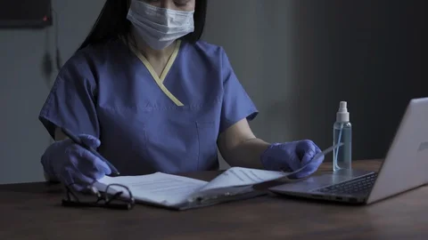Processing patients data doctor working on laptop Stock Footage 130060096