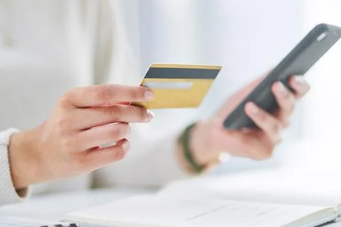 Processing payments to keep her business running. Closeup shot of an Foto stock