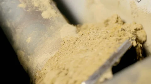 Processing plant. Yellow substance, similar to sand, is cleaned through special Stock Footage 194648480