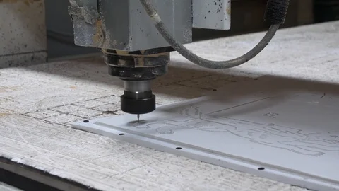 Processing of plastic with a milling machine at the factory. CNC milling machine Stock Footage 99540461