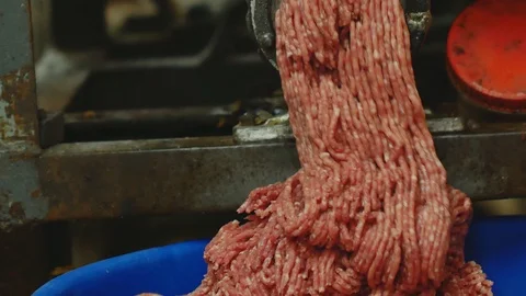 Processing of pork meat minced in a meat grinder Stock Footage 94218703