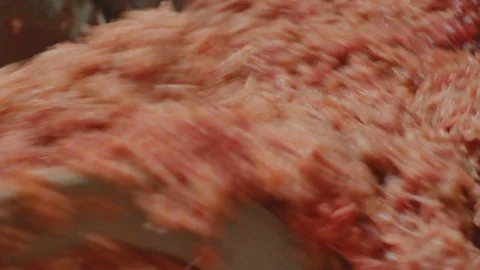 Processing of pork meat minced in a meat grinder Stock Footage 94218733