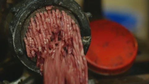 Processing of pork meat minced in a meat grinder Stock Footage 94219059