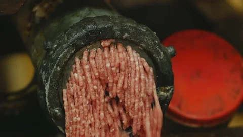 Processing of pork meat minced in a meat grinder Stock Footage 94219062