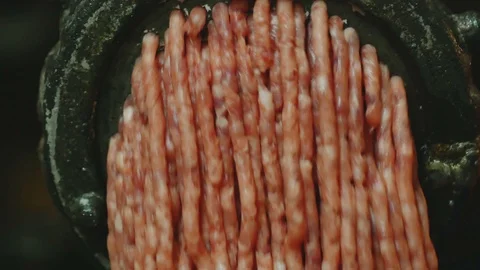 Processing of pork meat minced in a meat grinder Stock-Footage 94219149