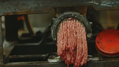 Processing of pork meat minced in a meat grinder Stock Footage 94219196