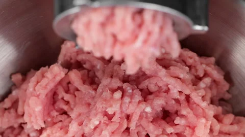 Processing pork meat in minced meat on a meat grinder Video stock 267682611