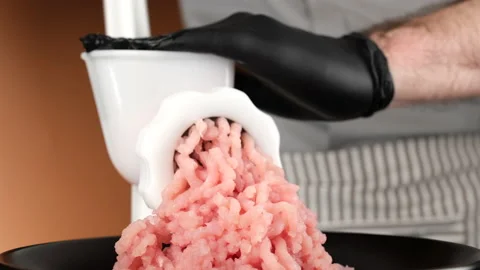 Processing pork or beef meat in minced meat on a hand meat grinder Stock-Footage 205022138