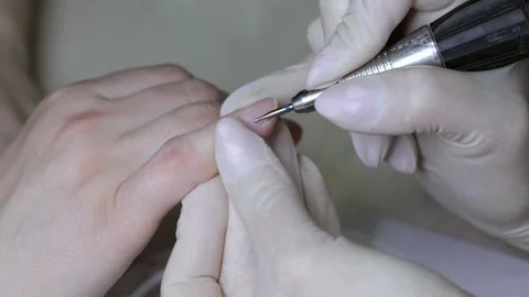 Processing of rough cuticles and lateral folds of fingernails. Stock Footage 164214174