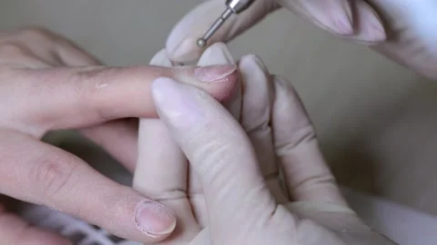 Processing of rough cuticles and lateral folds of fingernails. Video stock 164214450