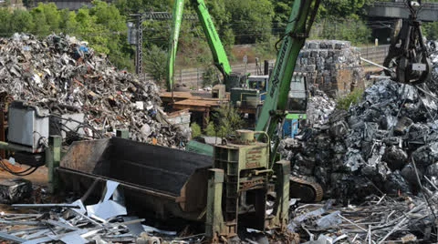 Processing scrap metal in baling machine united kingdom Stock Footage 25596865