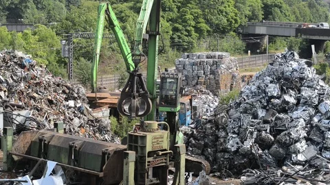 Processing scrap metal in baling machine united kingdom Stock Footage 85597837