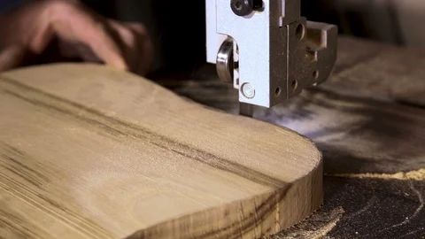 Processing the shape of wood products on a band saw close-up Stock-Footage 100751756