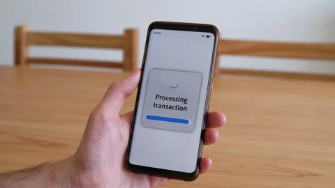 Processing transaction and payment approved notification on smartphone online Stock Footage 321358018