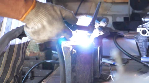 Processing of welding metal parts in garage. Mechanic or welder work Stock Footage 320397288