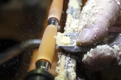 Processing a wooden block on carpentry machine using a milling cutter. Stock Photos