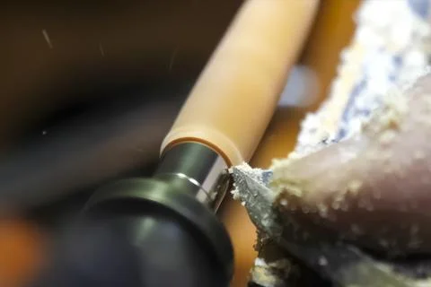 Processing a wooden block on carpentry machine using a milling cutter. Stock Photos