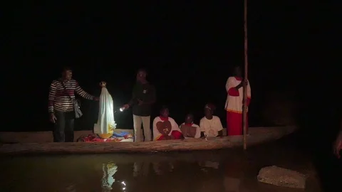Procession with madonna statue on canoe at night Stock Footage 104151954