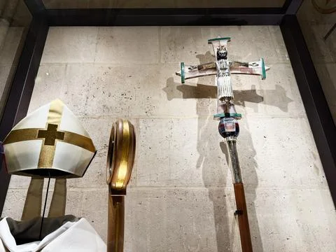 Processional cross, bishop mitre and crozier displayed in a Paris, France N.. Stock Photos