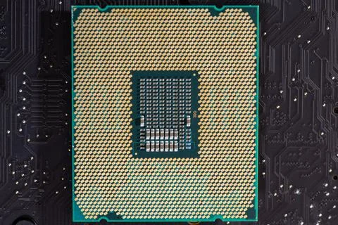 Processor on computer hardware. Circuit board in close-up background with pro 스톡 사진
