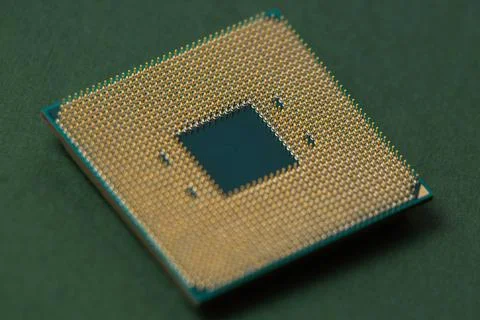 Processor for a computer lies on an isolated green background Stock Photos