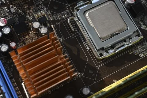 The processor of the computer on the motherboard. Electronic elements and a.. Stock Photos