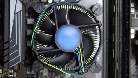 The processor cooler on the motherboard is spinning closeup. CPU cooling system Video stock 121720114