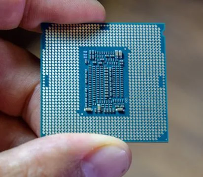 The processor is a desktop computer in hand. Inspect the CPU contacts before 写真素材