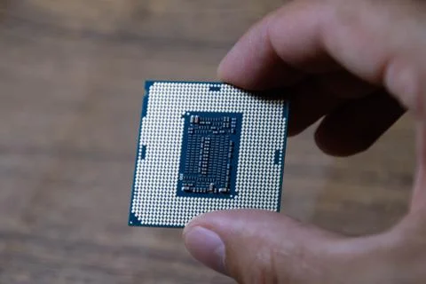 The processor is a desktop computer in hand. Inspect the CPU contacts before 写真素材