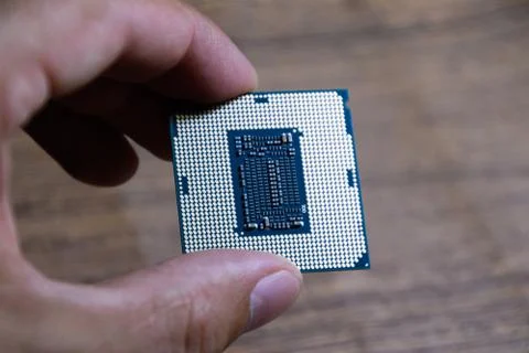 The processor is a desktop computer in hand. Inspect the CPU contacts before 写真素材
