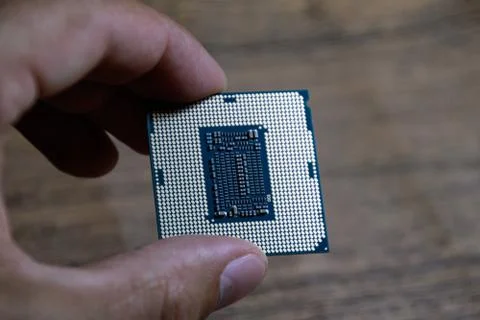 The processor is a desktop computer in hand. Inspect the CPU contacts before 写真素材