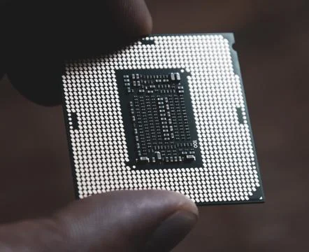 The processor is a desktop computer in hand. Inspect the CPU contacts before 写真素材