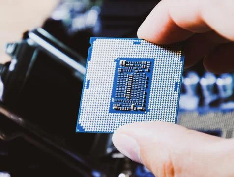 The processor is a desktop computer in hand. Inspect the CPU contacts before  写真素材