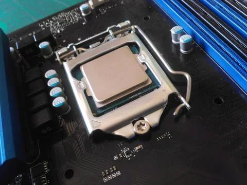 The processor is installed on the motherboard Stock Photos