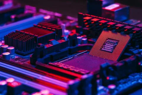 The processor on the motherboard in neon light. Computer parts. Close-up phot 写真素材