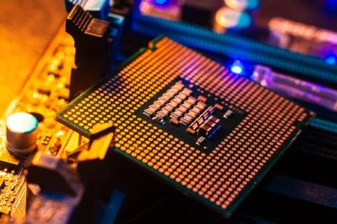 Processor with neon light. Large photo with blue-yellow light on a dark backg Stock Photos